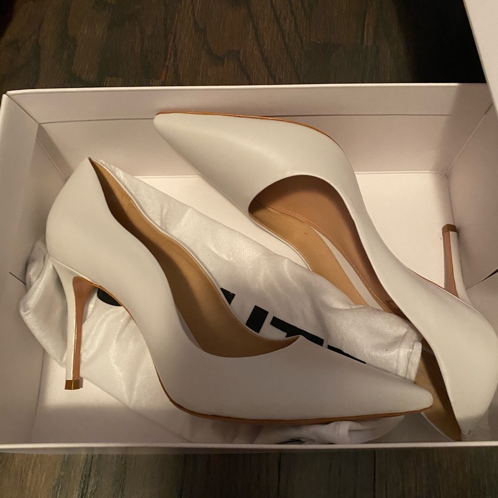 White pointed heels